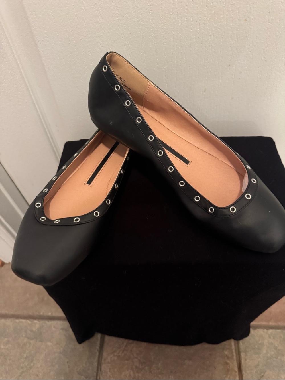 new directions Black Ballet Flats with Silver Eyelet Trim